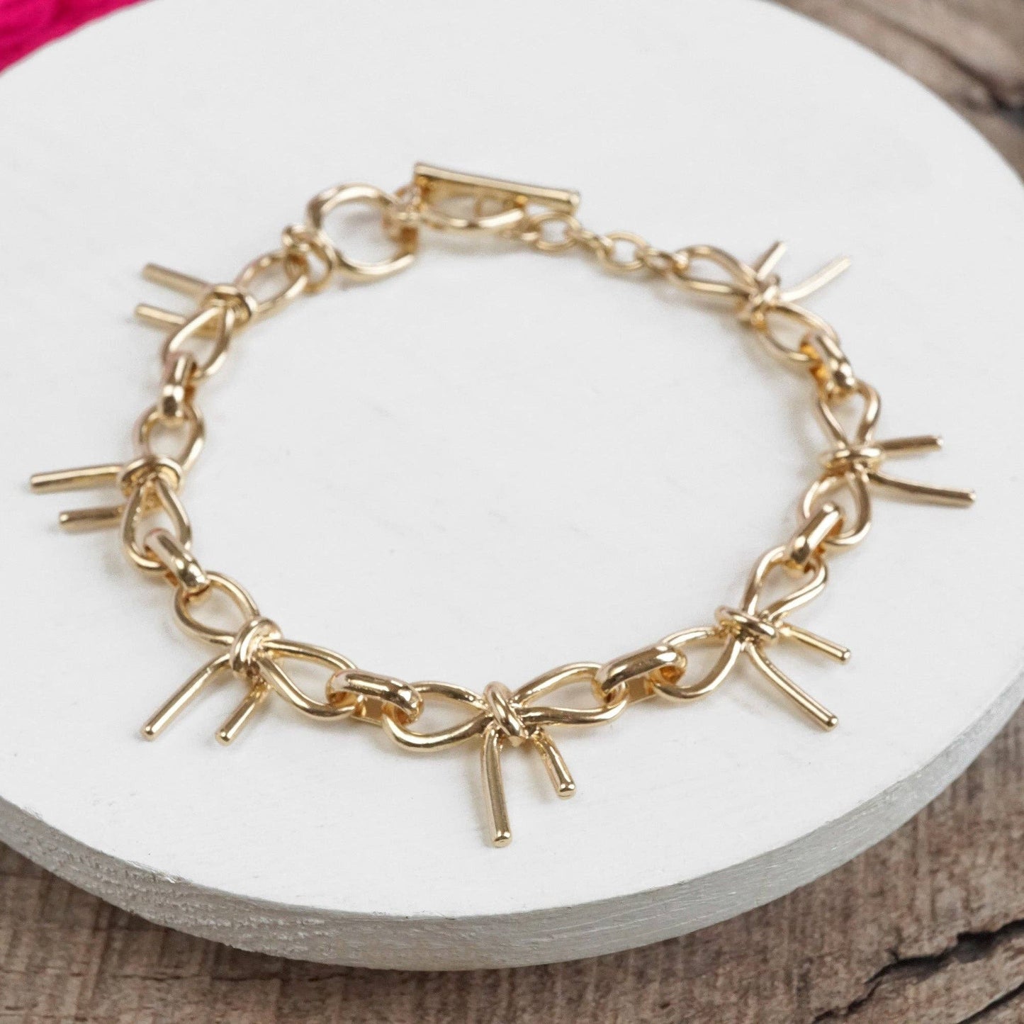 Bow Link Bracelet Gold Tone 2797