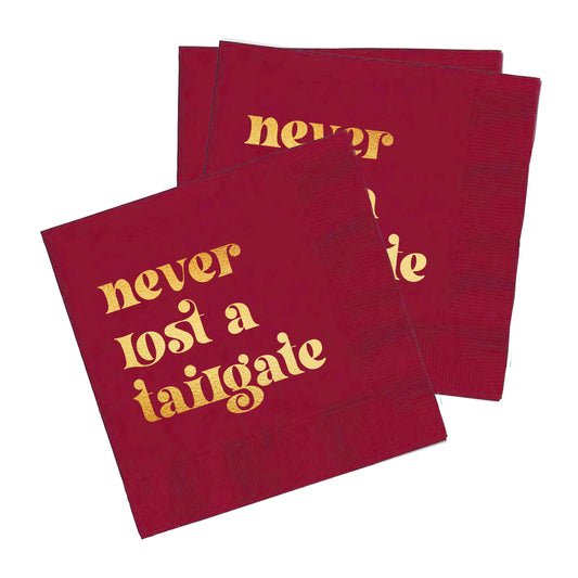 "Never Lost a Tailgate" gold foil + red napkin pack